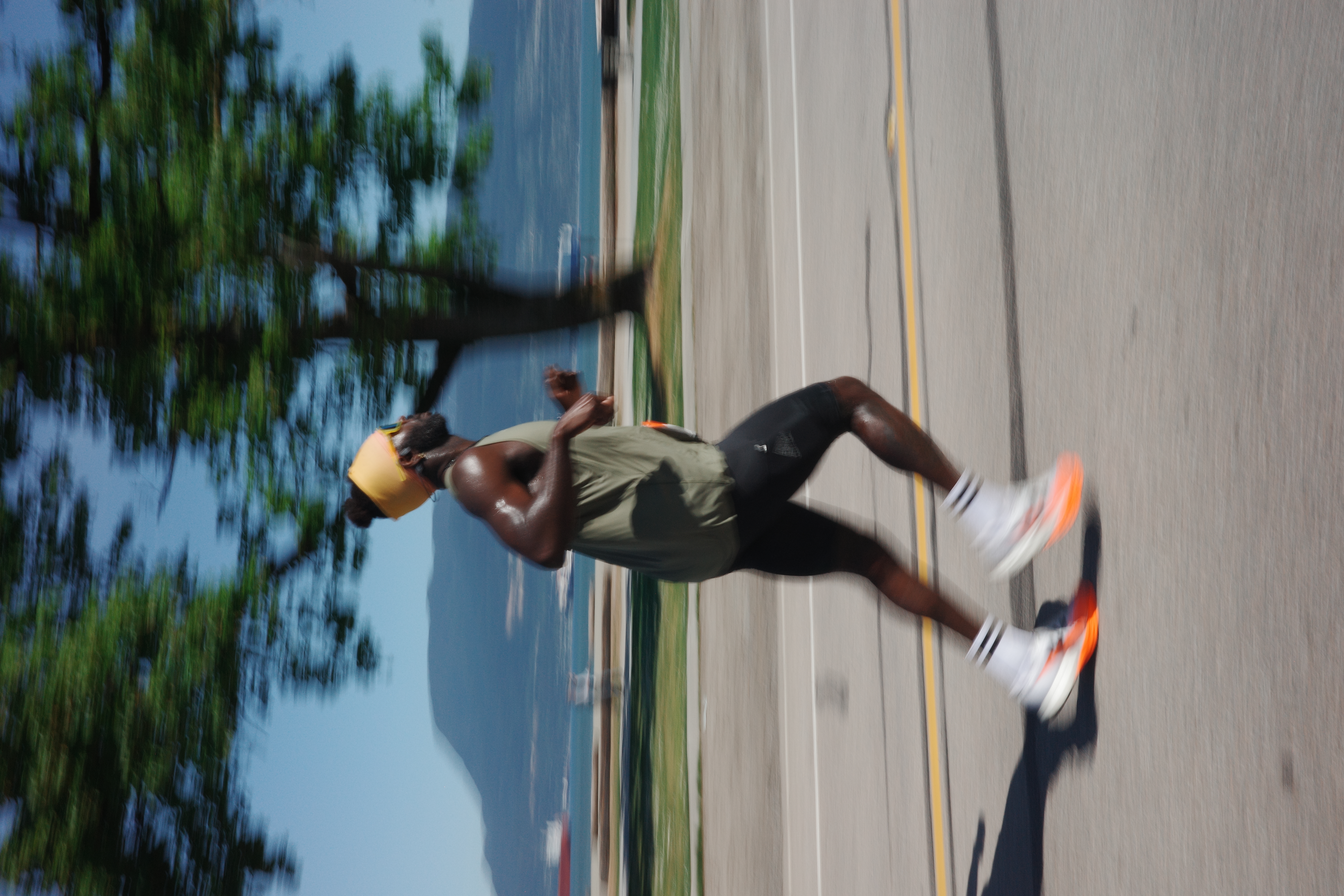Runner in motion on road