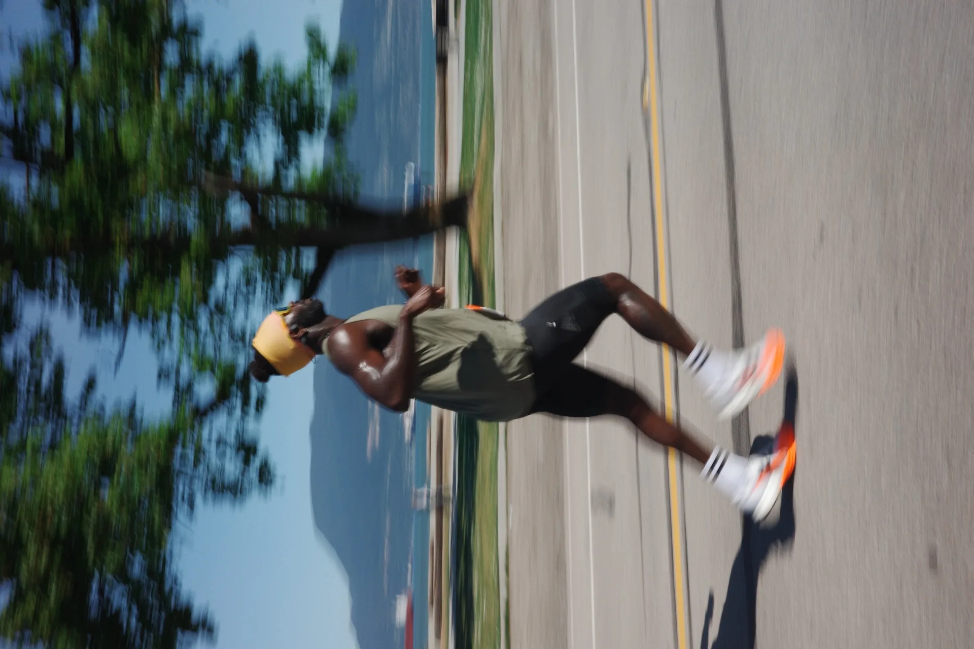Runner in motion on road